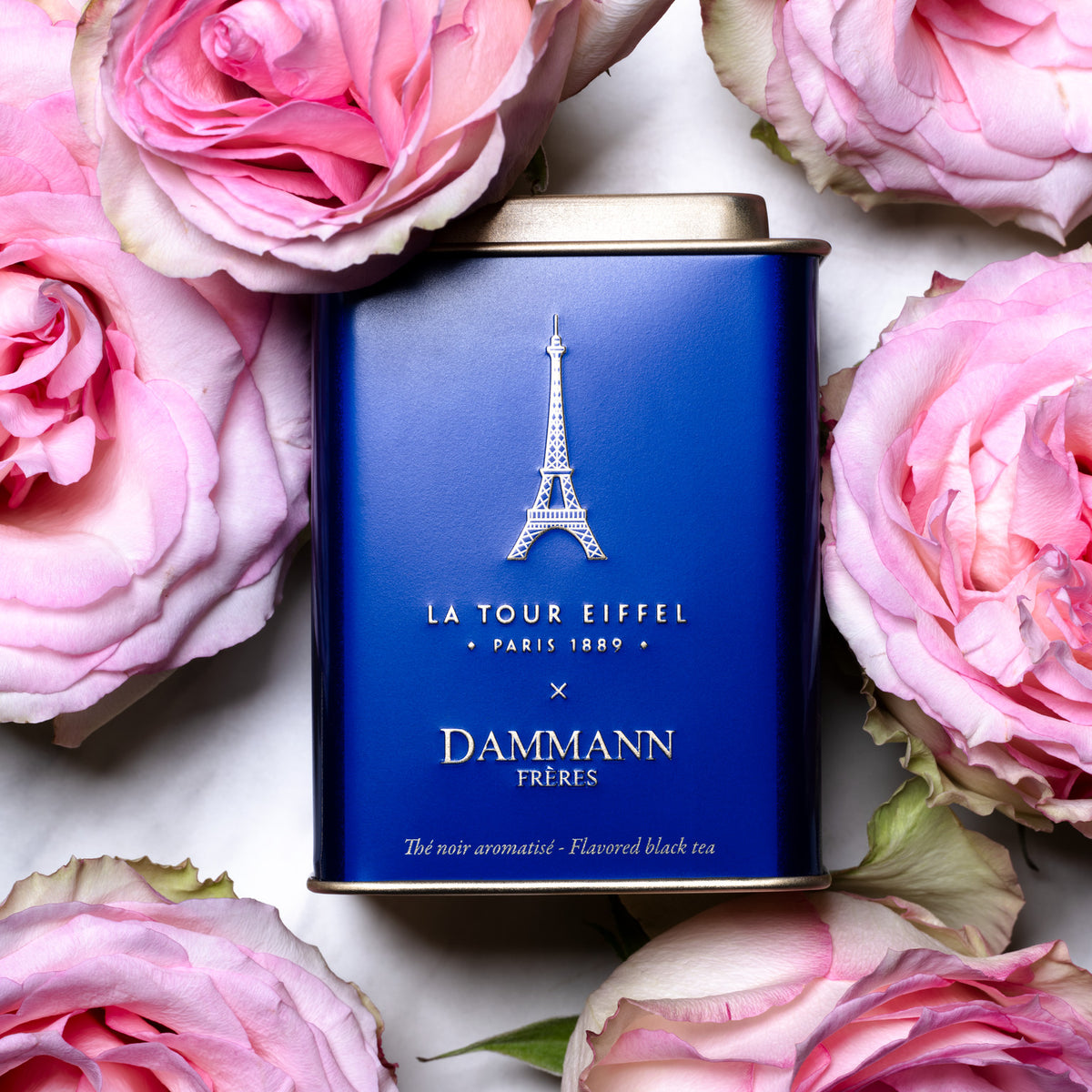 Tour Eiffel Tea tin by Dammann Frères among pink roses