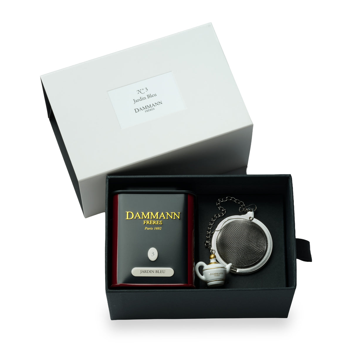 Coffret N°3 Jardin Bleu de Dammann Frères, ouvert avec une boîte de thé et une boule à thé