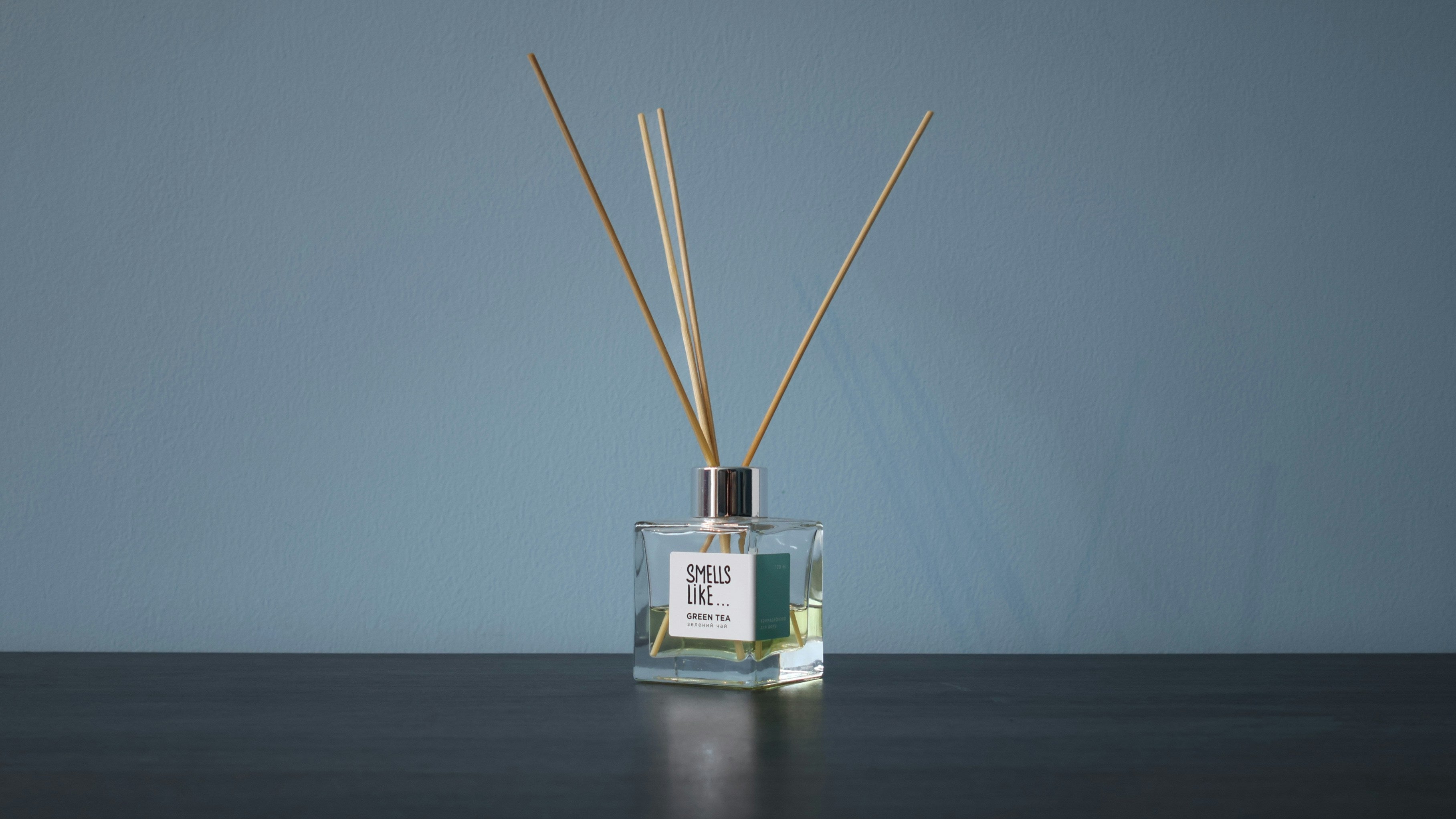 Alcohol-free French reed diffuser with natural reeds in a home setting