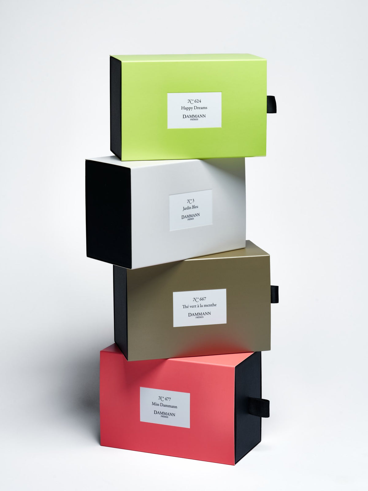 Stack of Dammann Frères drawer gift boxes including the khaki N°667 Thé vert à la menthe box