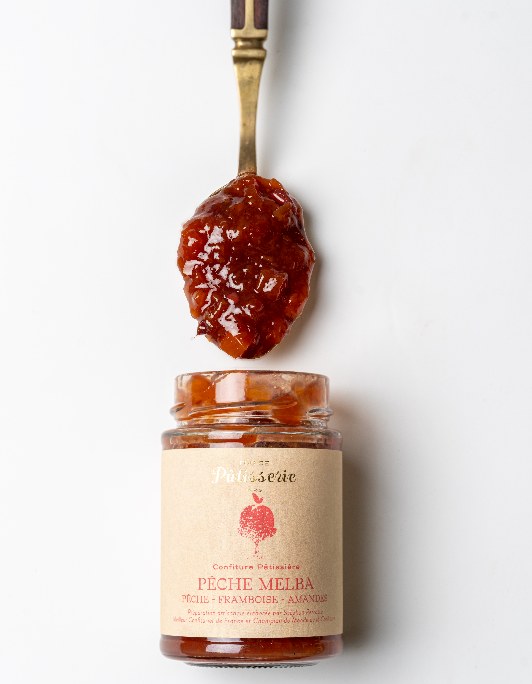 Maison Perrotte Peach Melba jam beside the dessert that inspired it